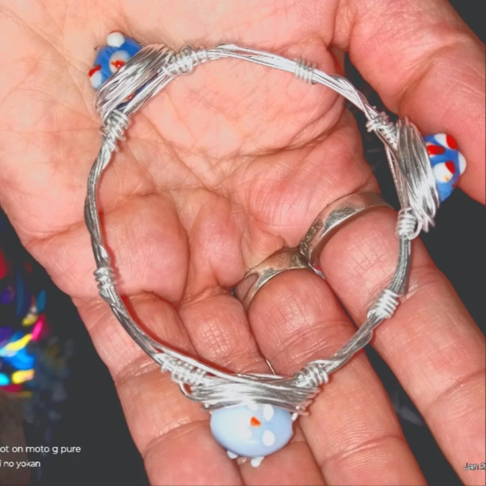 homemade glass lamp work bumpy beads and silver wrapped wire bracelet